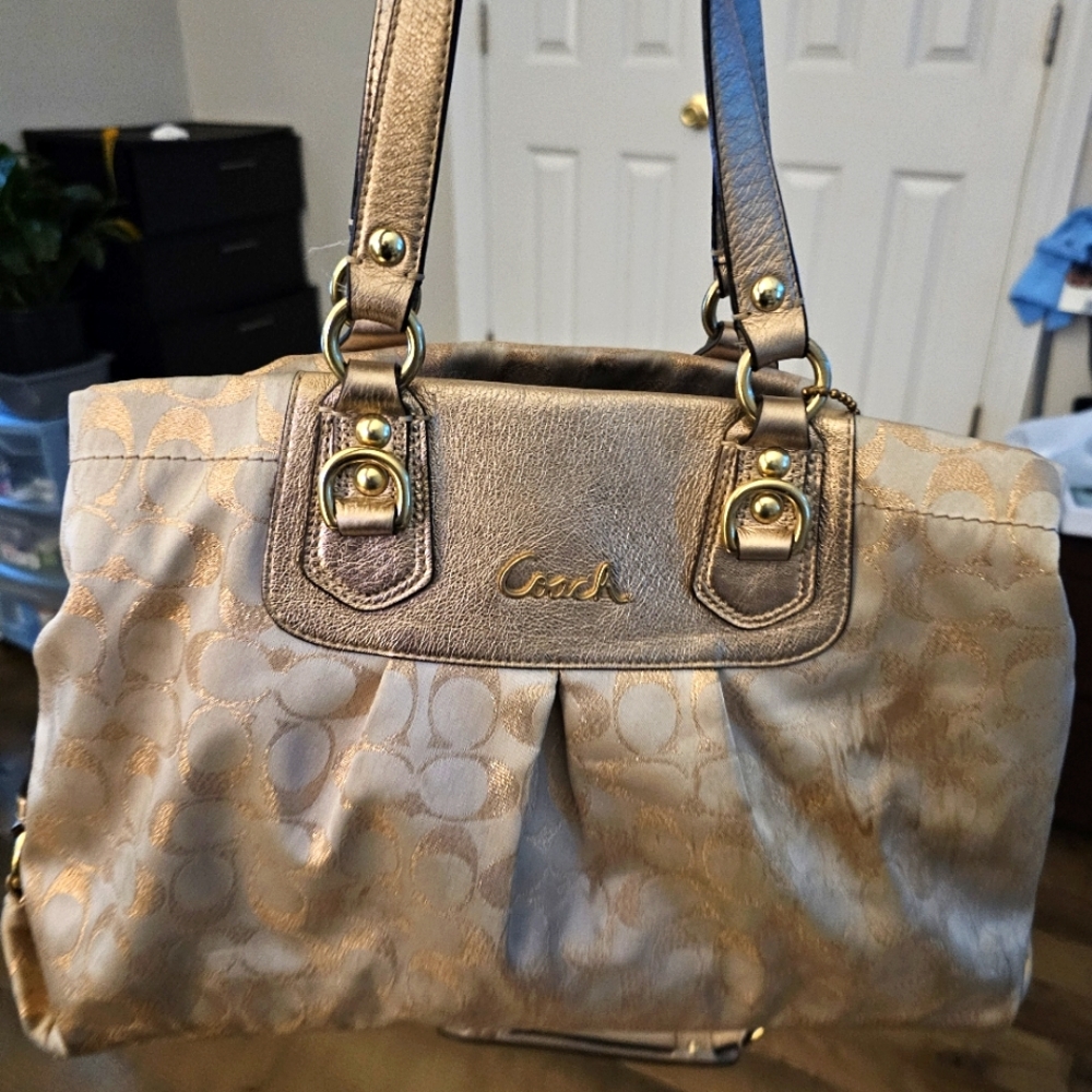 Women's medium size, Gold purse by Coach, great condition